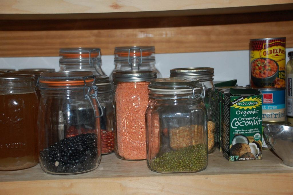 A close up of a dry beans in a jar in the pantry