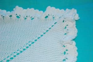 A close up view of knit baby blanket edging