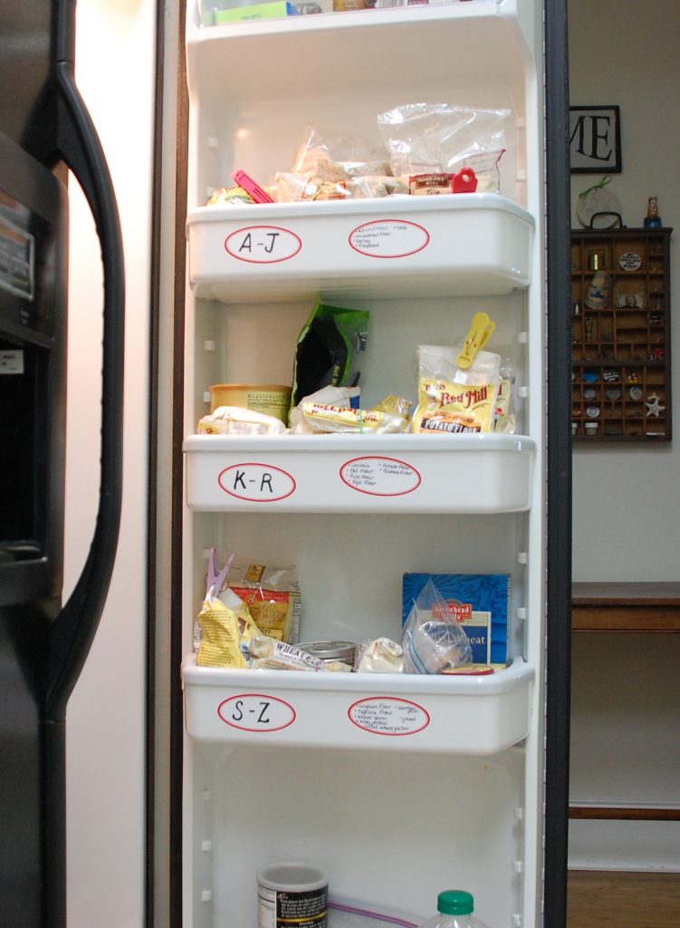 Spare refrigerator used to help organize and store pantry contents 