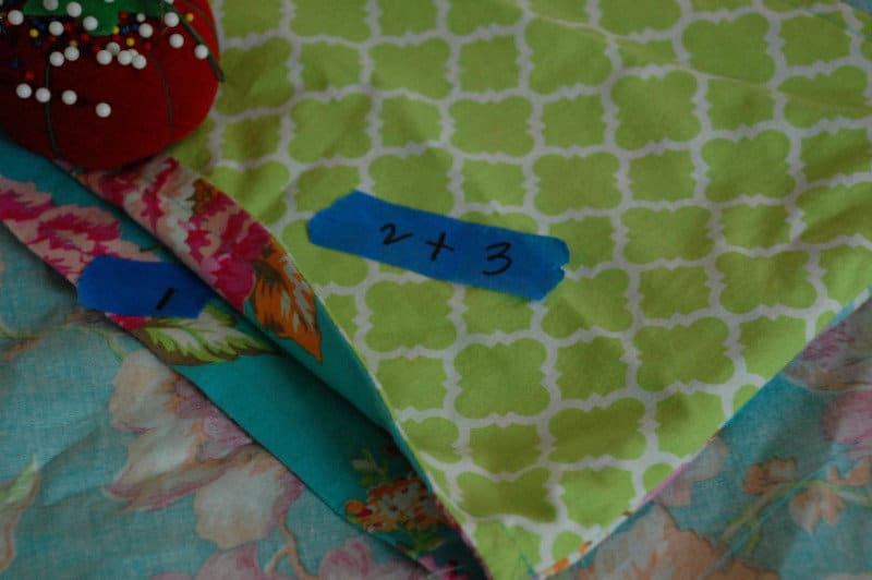 close up of edges of pillow case fabric with numbers to show where to pin edges