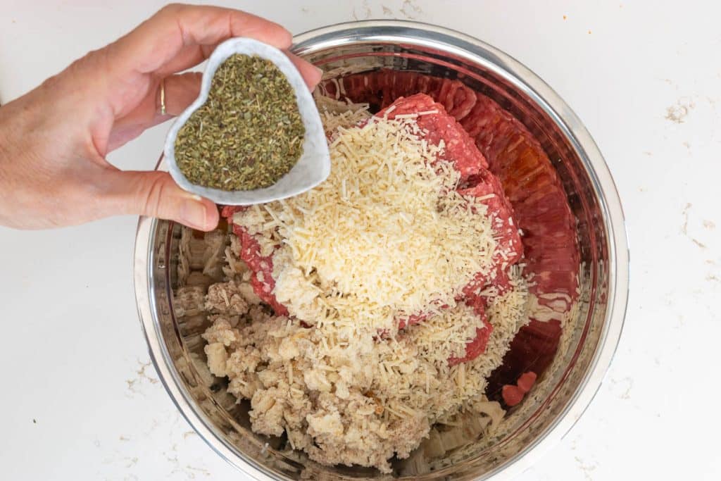 Add oregano to meatball mixture.