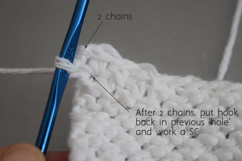 Chinese Wave Stitch: Third step in turning corner for crochet edge of knit washcloth