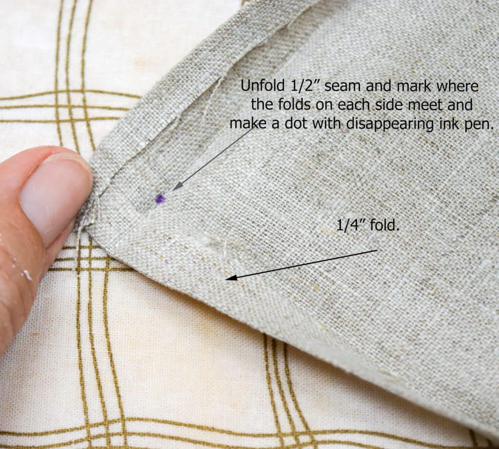 Folds in napkin, with markings showing where to fold.