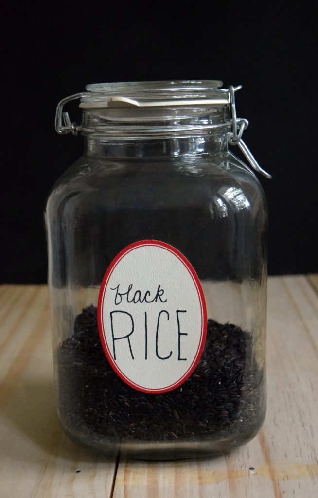 satay chicken and rice recipe - jar of black rice on counter