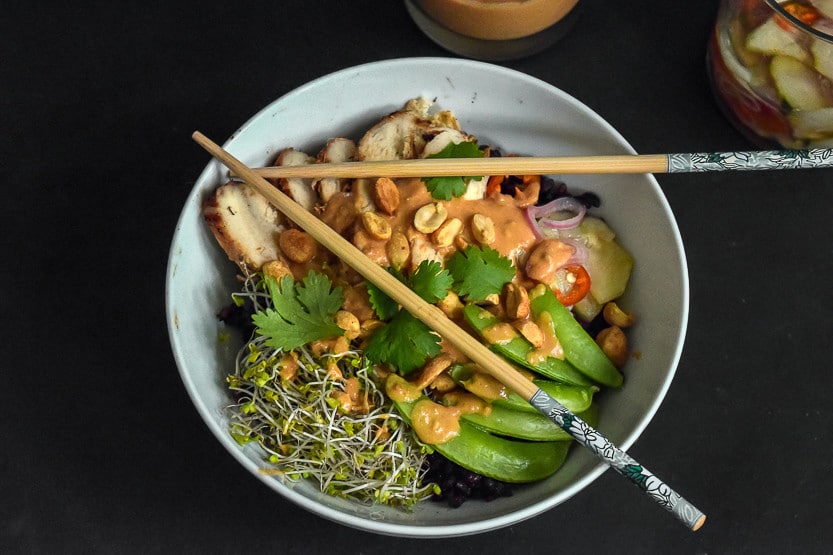 Satay Chicken Rice Bowl recipe - finished rice bowl serving with chopsticks