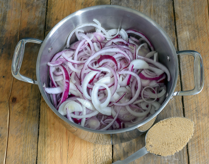 A Savory red onion jam recipe with thyme. This delicious jam is perfect on sandwiches, pizzas and as a condiment for a meat and cheese tray.