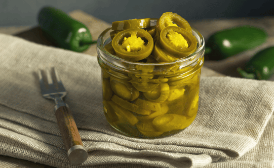 jar of pickled and canned jalapeno peppers