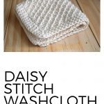 Daisy Stitch Washcloth Pattern on a piece of wood.