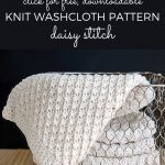 Daisy Stitch Washcloth Pattern in basket against a black background.