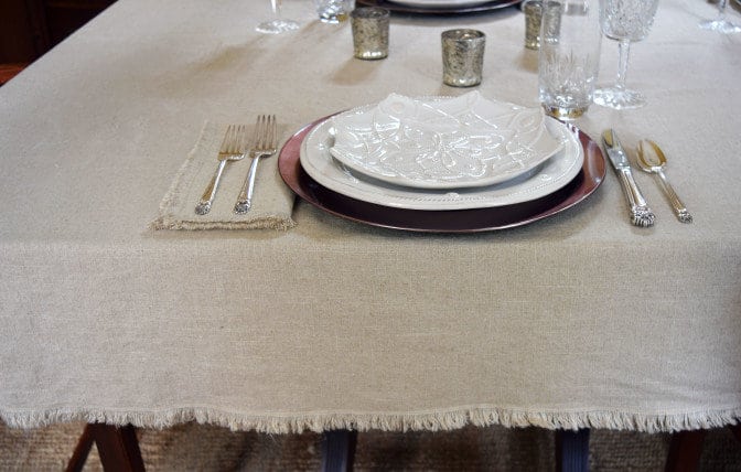DIY a fringed tablecloth and napkins. Can be dressed up or dressed down to suit your table and home decor