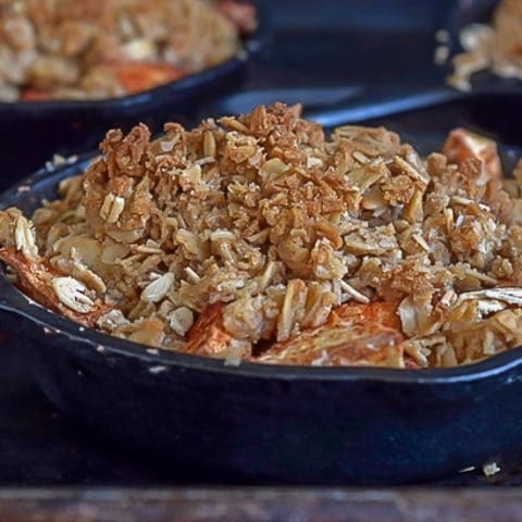 A recipe for individual apple crumbles. A healthy & easy dessert made in individual ramekins or mini cast iron skillets, but can be made in a baking dish.