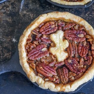 Need dessert? Recipe for delicious individual cast iron skillet pecan pie. Instructions for traditional 9" pie as included as well.