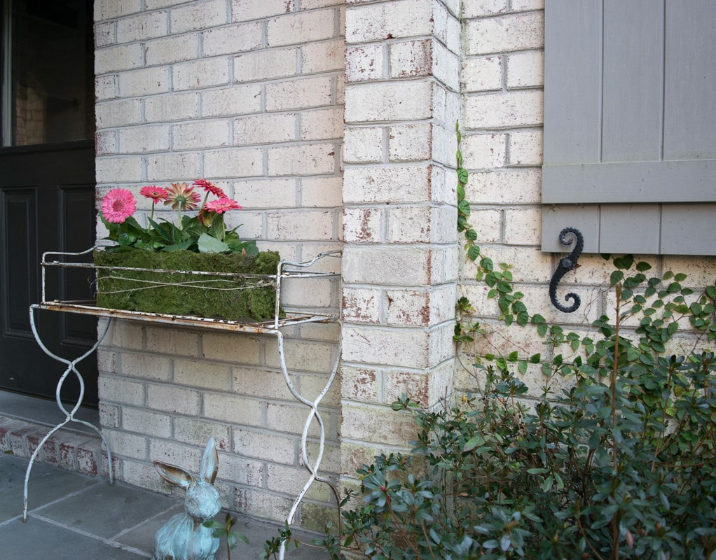 DIY Spring Craft ideas - mossy planter and painted bunny on spring front porch
