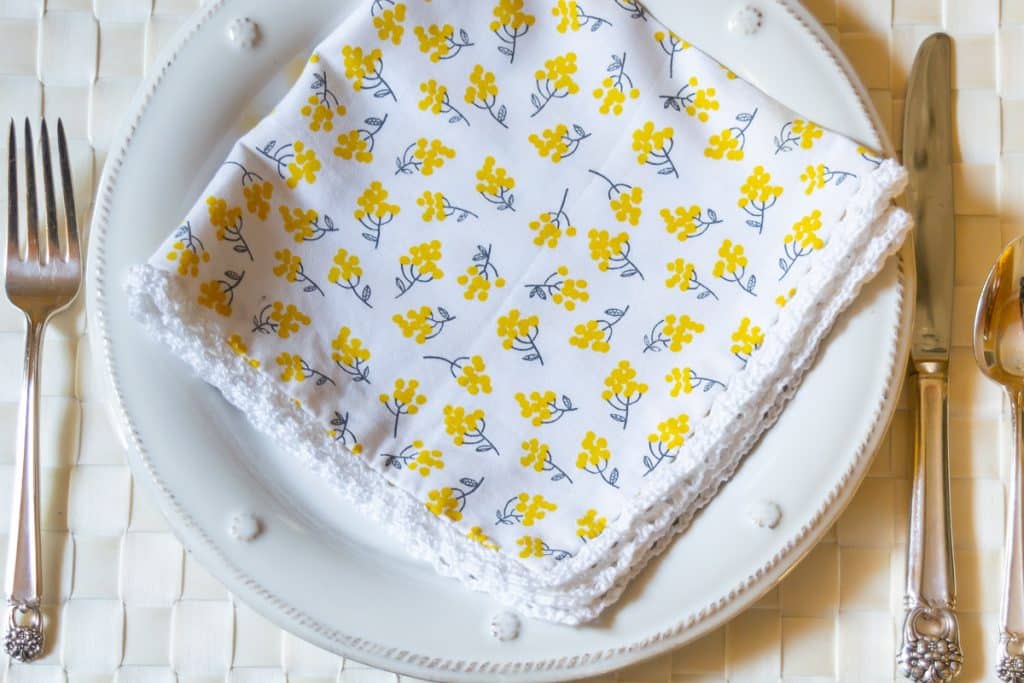 An easy to make napkin on a white plate.