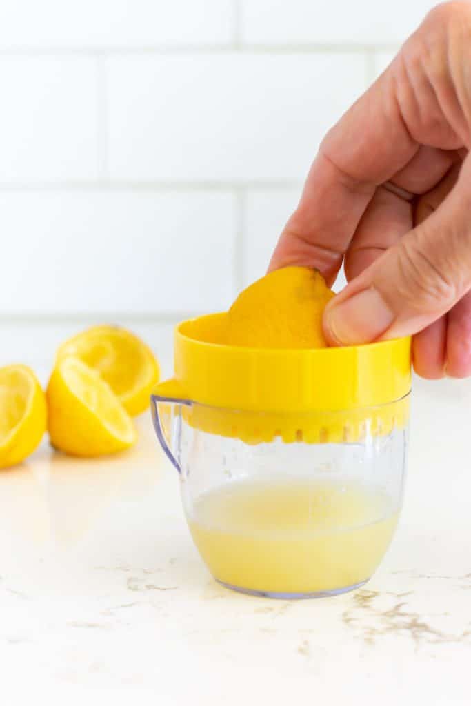 Squeezing lemon juice.
