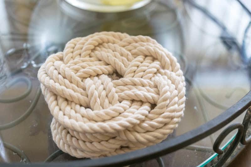 Turk's Head Knot Instructions: Flat Turk's Head Knot rope coasters stacked on serving tray