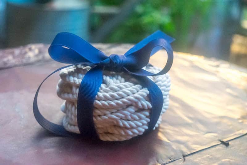A Flat Turk's Head Knot is perfect for diy coasters & trivets. Close up of rope coasters stacked and gift wrapped