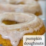 Closeup of baked pumpkin donuts with chai glaze.