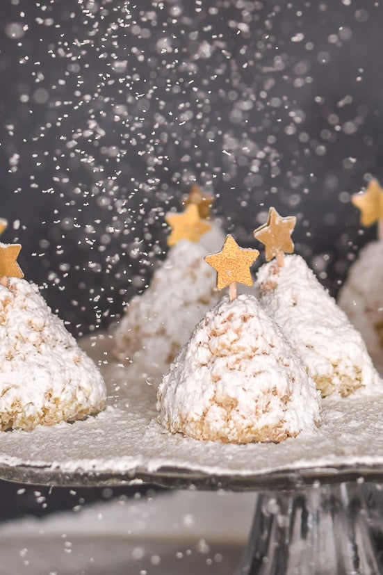 Christmas Tree cookie recipe: powdered sugar snow falling on the coconut cookies