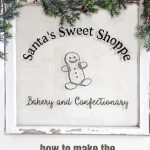 Painted Window with garland which says 'Santa's Sweet Shoppe Bakery and Confectionary'