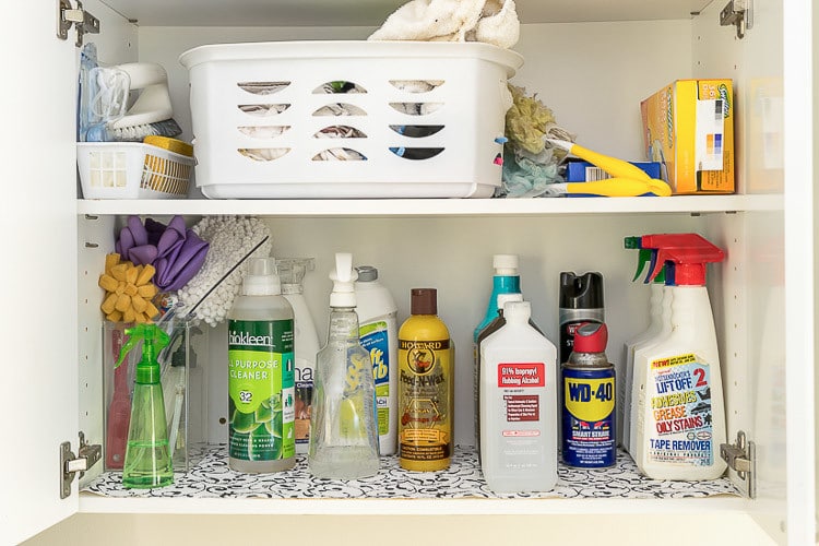 organized cleaning supplies in laundry room