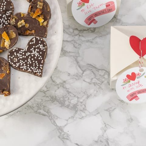 Recipe for Valentine's Day Chocolate Bark, with a variety of topping options. PLUS, a free printable for Valentine's Day gift tags.