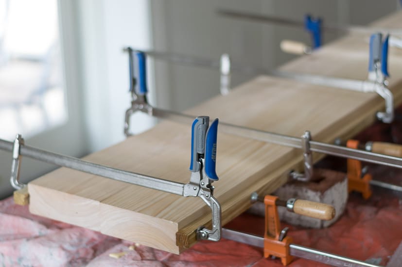 How to build a console table: using bar clamps to glue wood top pieces together