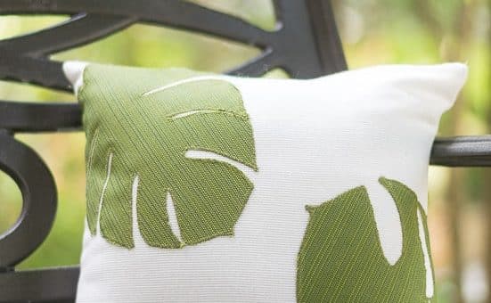 Love these pillows! Use a Cricut to cut the tropical leaf shapes and then just sew them on a white pillow cover. Use outdoor fabric for spring and summer porch decor or regular fabric for your home decor. #cricutmade @officialcricut (sponsored by Cricut)