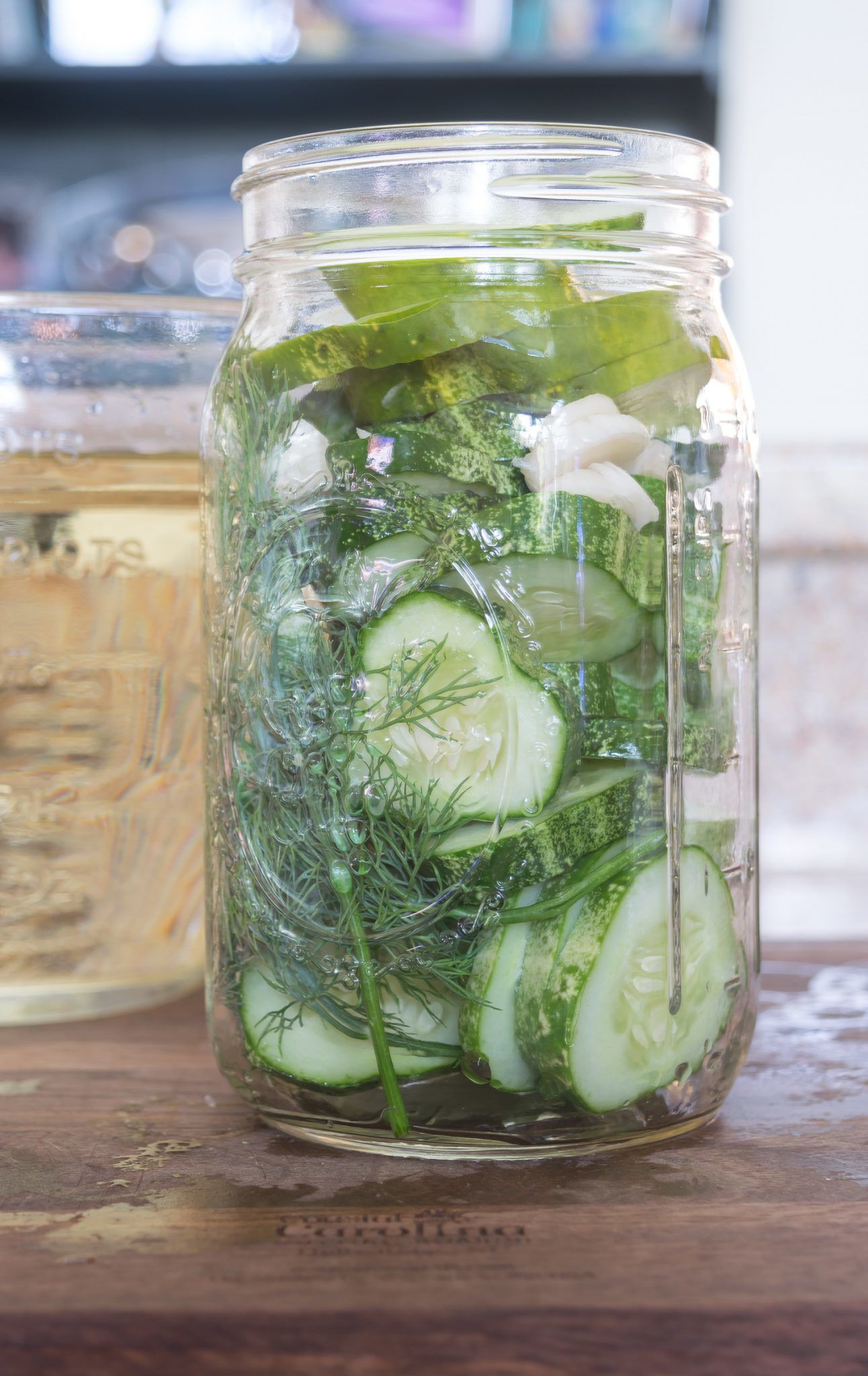 Refrigerator Dill Pickle Recipe: sliced cucumbers and dill in jar ready for pickle brine