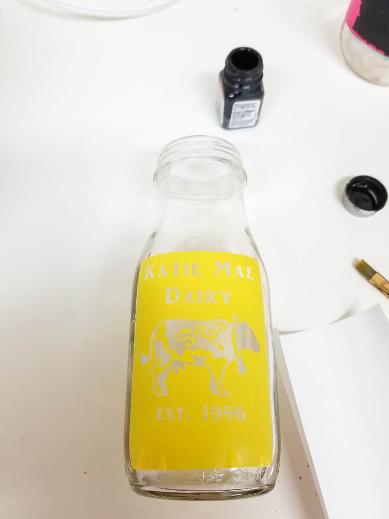 Use testors paint to stencil the diy glass milk bottle