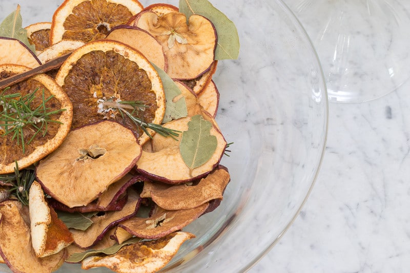 Dried apple and orange potpourri in a bowl.
