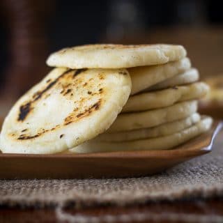 Arepa are gluten-free, thick tortilla-like bread from South America. This Arepa recipe is easy to make and is the perfect gluten free substitute for bread.