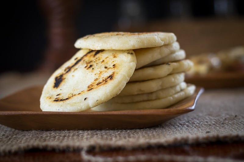 Arepa are gluten-free, thick tortilla-like bread from South America. This Arepa recipe is easy to make and is the perfect gluten free substitute for bread.