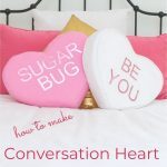 Conversation Heart Pillows on Bed