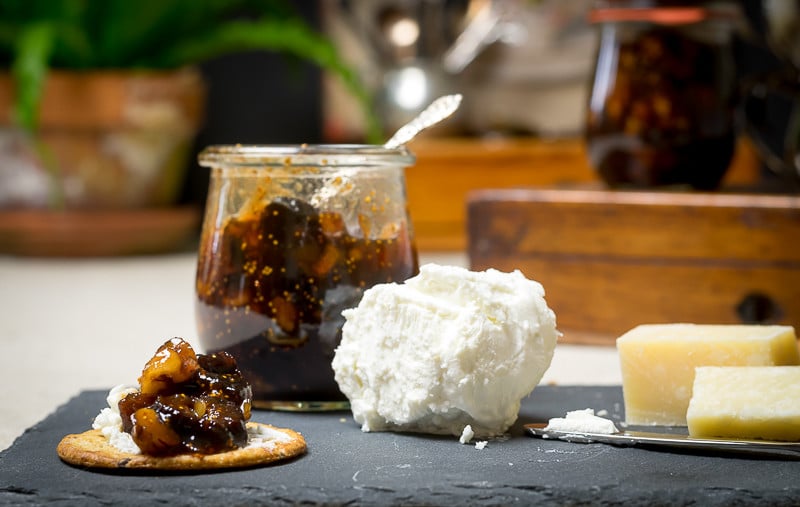 Dried Fig Conserve: a chunky dried fig jam recipe - being served with crackers on meat and cheese board