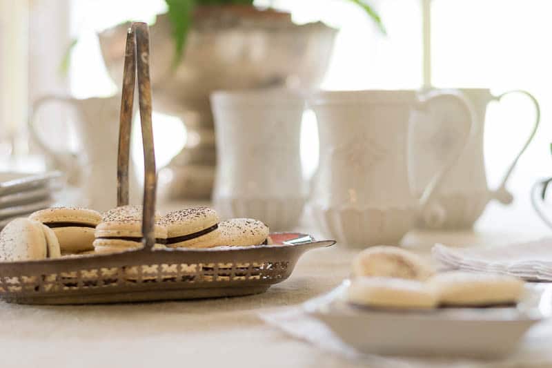 French Macaron Recipe: plate and serving dish full of Espresso Chocolate macarons