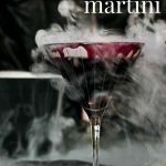 Black Widow Martini Cocktail with smoke coming out of glass