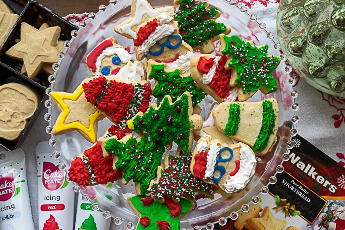 Christmas cookie decorating ideas: plate full of finished, decorated Christmas cookies 