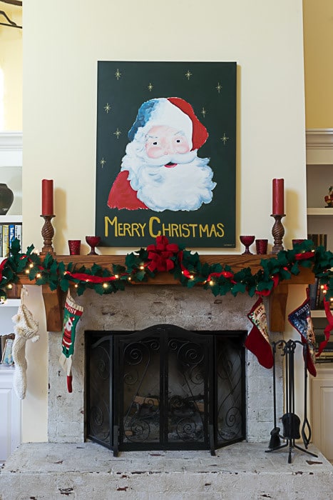 Christmas decorations: Santa painting over the mantle