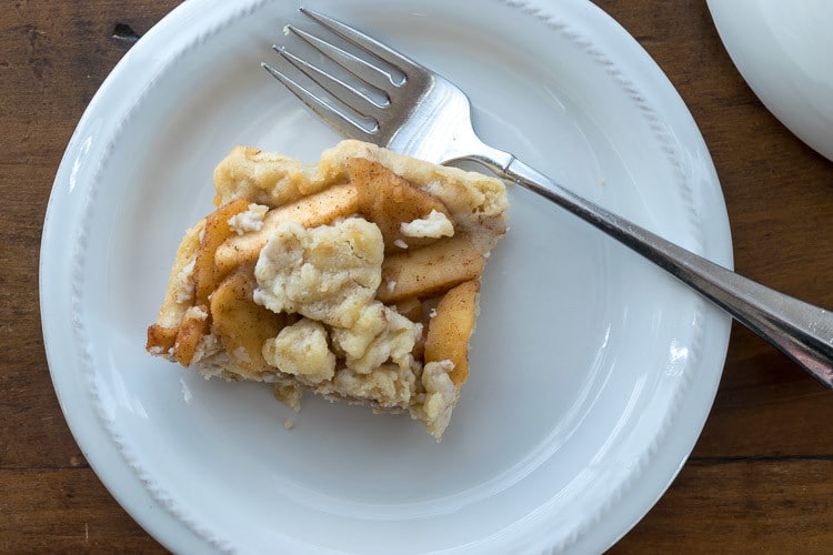 Apple crumble bars with oats and apple pie filling : overhead view of serving on plate with fork