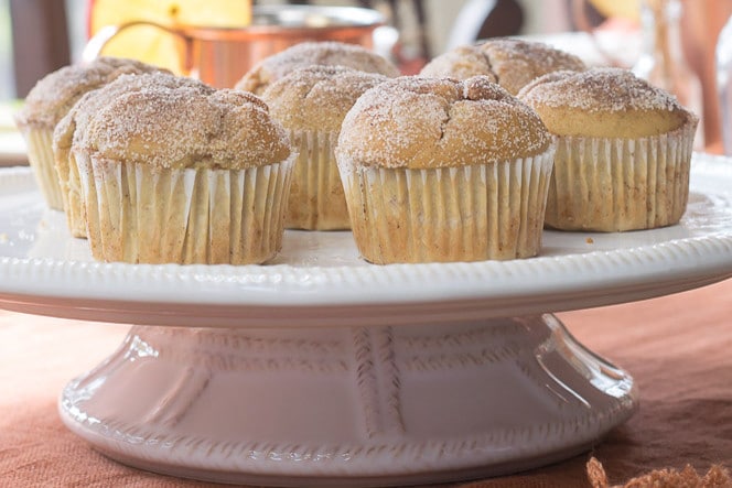 Apple Cider Muffins image of muffins on a cake stand up close