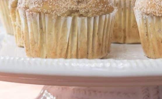 Apple Cider Muffins image of muffins on a cake stand up close
