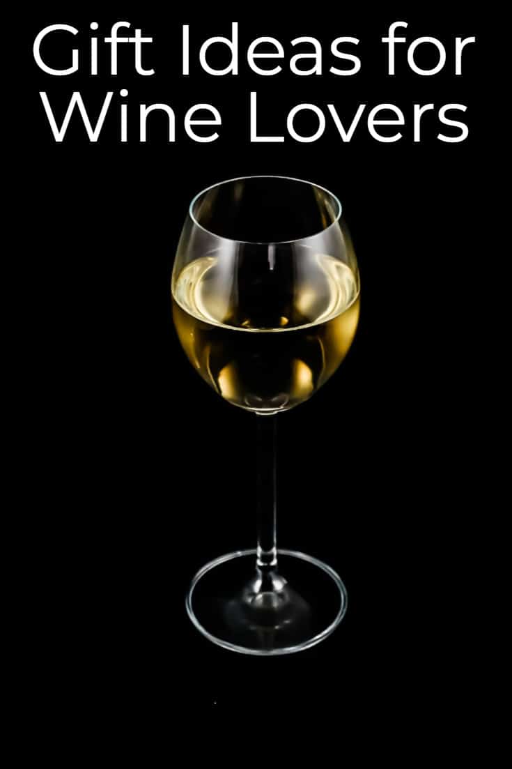 Glass of White Wine on a Black background. Nine Best Gifts for Wine Lovers