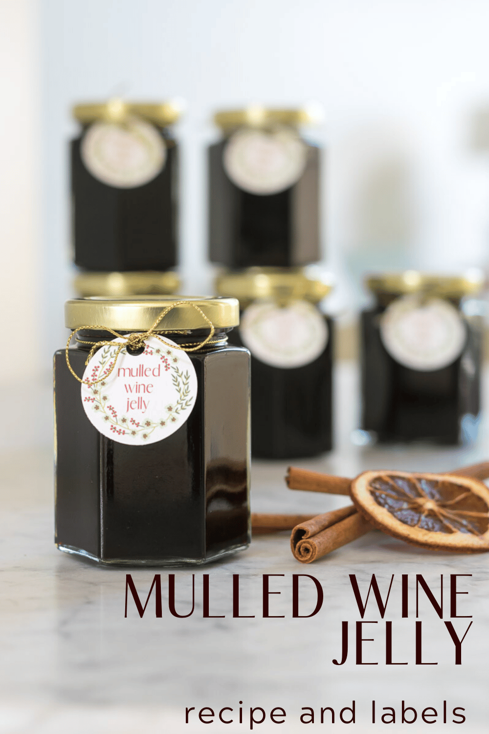 Jars of Mulled Red Wine Jelly with cinnamon sticks and dried orange slices