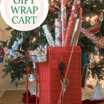 DIY Gift Wrap Cart and Organizer filled with paper and in front of Christmas Tree