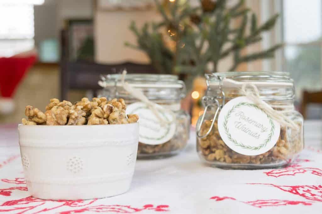 Roasted Walnuts with Rosemary in a bowl and in jars with tags