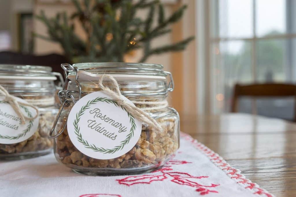 Roasted Walnuts with Rosemary in a bowl and in jars with tags