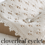 cloverleaf eyelet baby blanket in box with rattle