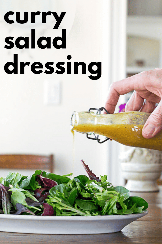 Pouring Curry Salad Dressing over Greens