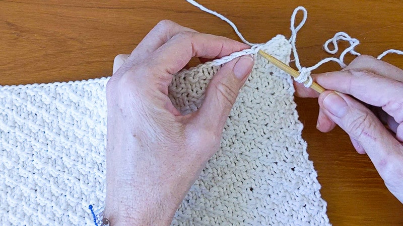 Put knitting needle into washcloth to start applied i-cord